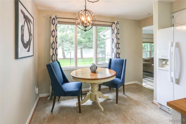 92 Bridle Path, Amherst, NY 14221 - dining area featuring a chandelier and healthy amount of natural light