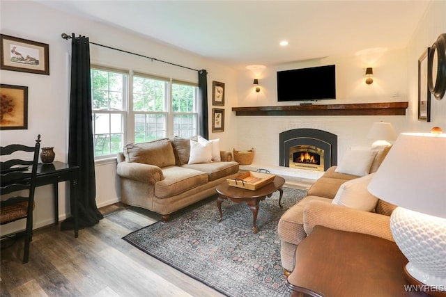 92 Bridle Path, Amherst, NY 14221 - living area with wood finished floors, a lit fireplace, and recessed lighting