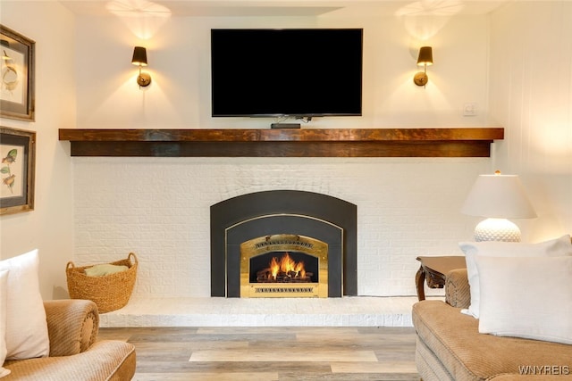 92 Bridle Path, Amherst, NY 14221 - detailed view of wood finished floors and a brick fireplace