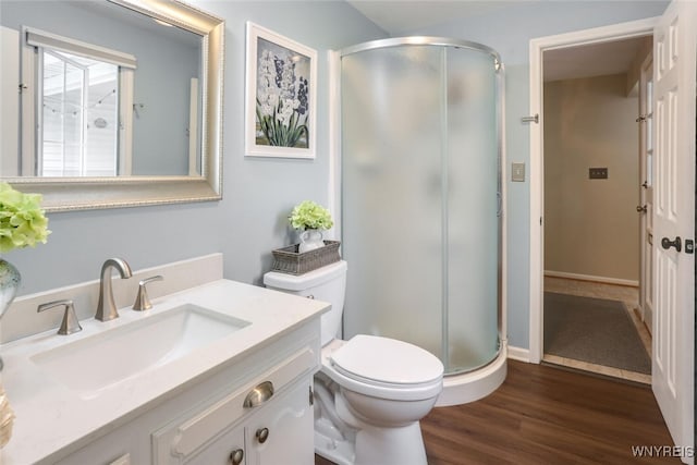 92 Bridle Path, Amherst, NY 14221 - bathroom with a stall shower, vanity, and wood finished floors