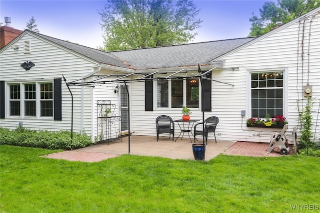 92 Bridle Path, Amherst, NY 14221 - back of property featuring a patio, a yard, and roof with shingles