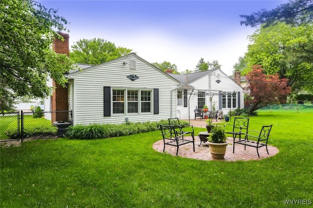 92 Bridle Path, Amherst, NY 14221 - back of property featuring a chimney and a patio