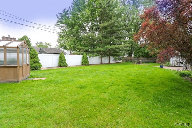 92 Bridle Path, Amherst, NY 14221 - fenced backyard featuring a greenhouse and an outbuilding