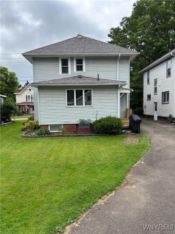 126 N 8th St, Olean-City, NY 14760 - back of property with a yard and roof with shingles
