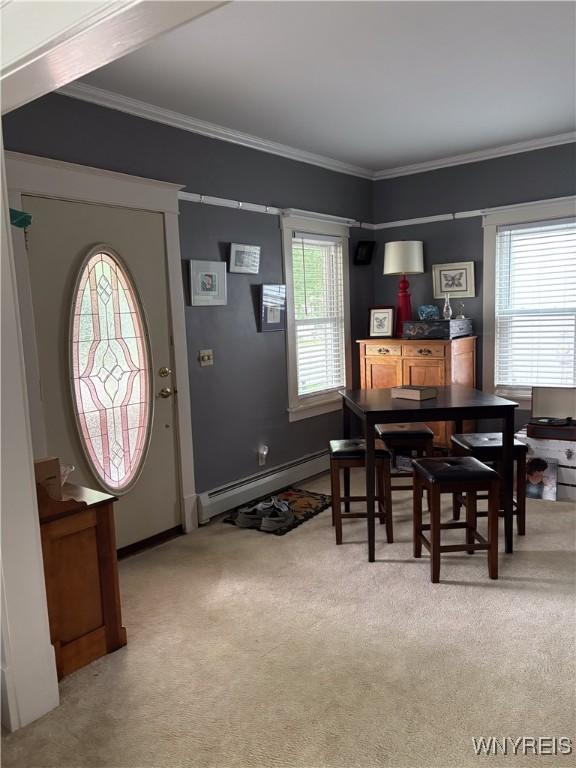 126 N 8th St, Olean-City, NY 14760 - dining room featuring a baseboard radiator, healthy amount of natural light, light carpet, and crown molding