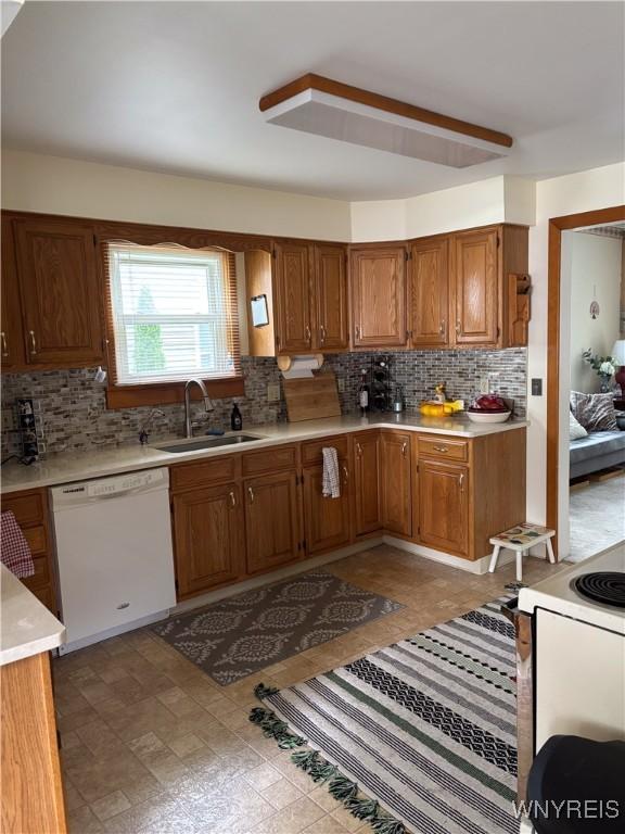 126 N 8th St, Olean-City, NY 14760 - kitchen with white appliances, backsplash, and light countertops