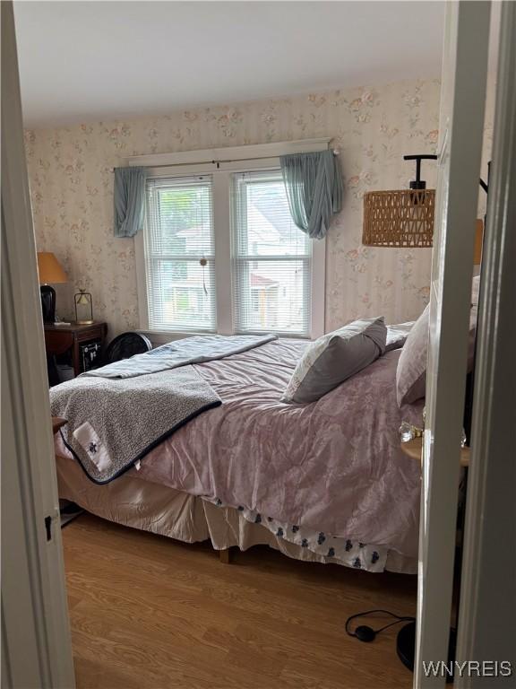126 N 8th St, Olean-City, NY 14760 - bedroom featuring wallpapered walls and wood finished floors