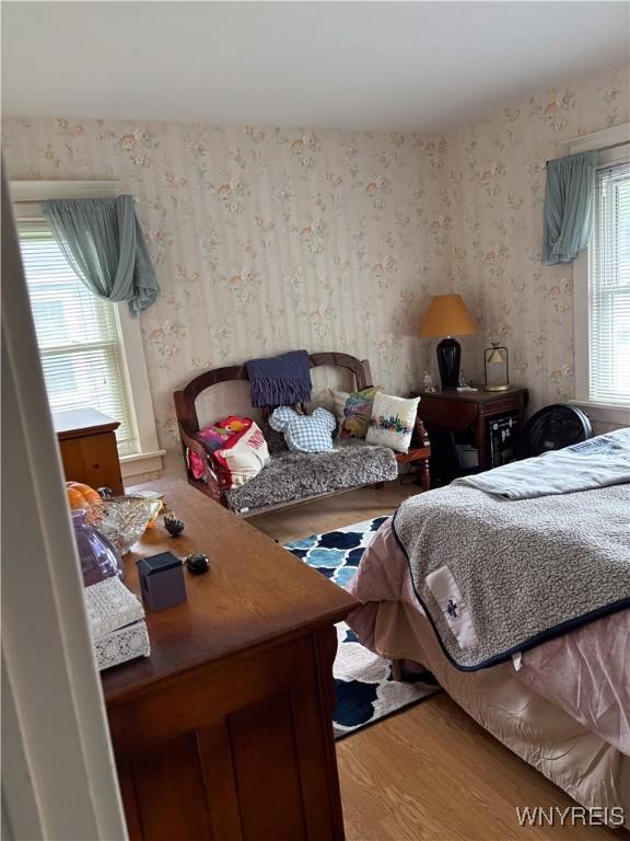 126 N 8th St, Olean-City, NY 14760 - bedroom featuring wallpapered walls and wood finished floors