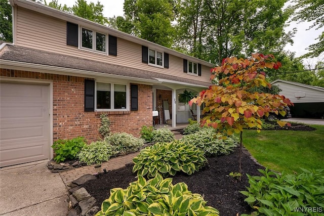 20 Dan Troy Dr, Amherst, NY 14221 - traditional home featuring a garage and brick siding