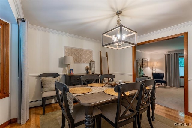 20 Dan Troy Dr, Amherst, NY 14221 - dining space with ornamental molding, a chandelier, light wood finished floors, and a baseboard heating unit