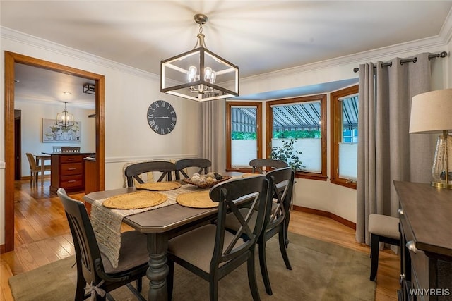 20 Dan Troy Dr, Amherst, NY 14221 - dining room with a chandelier, wood finished floors, and ornamental molding