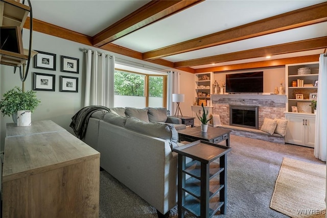 20 Dan Troy Dr, Amherst, NY 14221 - living area featuring beamed ceiling, carpet floors, and a fireplace