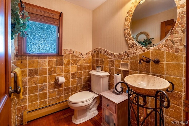 20 Dan Troy Dr, Amherst, NY 14221 - bathroom with a baseboard radiator, wood finished floors, tile walls, and wainscoting