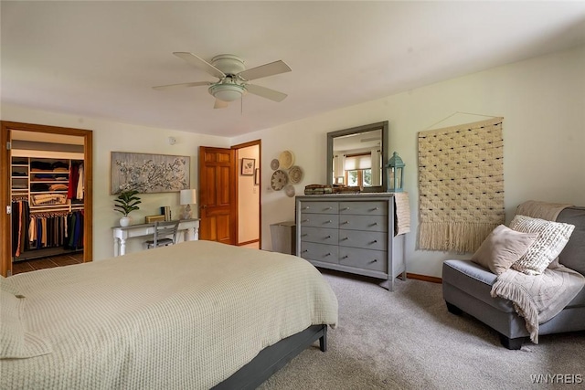 20 Dan Troy Dr, Amherst, NY 14221 - bedroom featuring a walk in closet, a ceiling fan, a closet, and carpet flooring