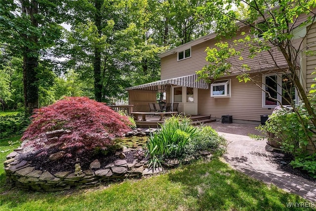20 Dan Troy Dr, Amherst, NY 14221 - back of property with a wooden deck and a patio area