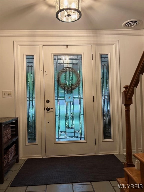 20 Dan Troy Dr, Amherst, NY 14221 - foyer entrance with stairway, tile patterned floors, and ornamental molding