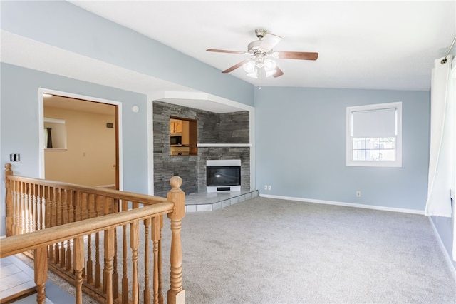 32 Princess Dr, Henrietta, NY 14623 - unfurnished living room with ceiling fan, carpet, and a tile fireplace