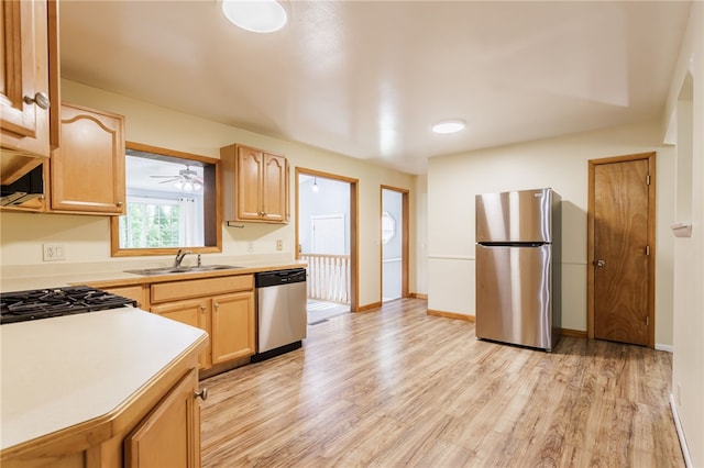 32 Princess Dr, Henrietta, NY 14623 - kitchen with stainless steel appliances, light countertops, light wood-style flooring, light brown cabinetry, and ceiling fan