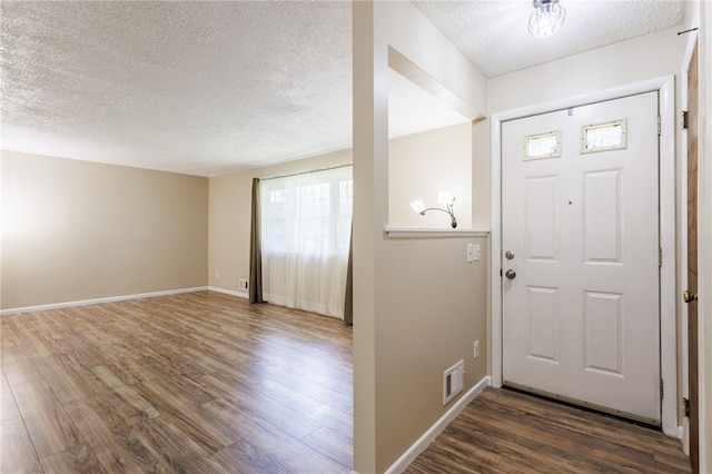 32 Princess Dr, Henrietta, NY 14623 - entrance foyer featuring a textured ceiling and wood finished floors