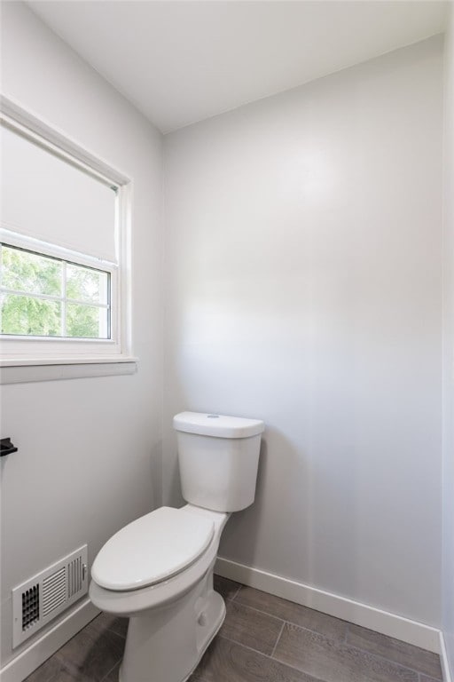 32 Princess Dr, Henrietta, NY 14623 - bathroom with toilet and wood finished floors
