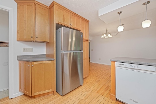 39 Southwind Ct, Greece, NY 14626 - kitchen featuring freestanding refrigerator, dishwasher, light wood finished floors, and a chandelier