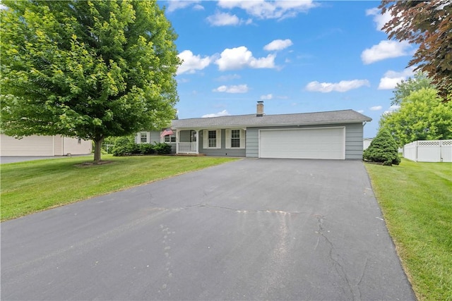 39 Southwind Ct, Greece, NY 14626 - single story home featuring an attached garage, asphalt driveway, and a chimney