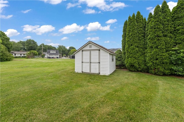 39 Southwind Ct, Greece, NY 14626 - view of green lawn featuring a shed