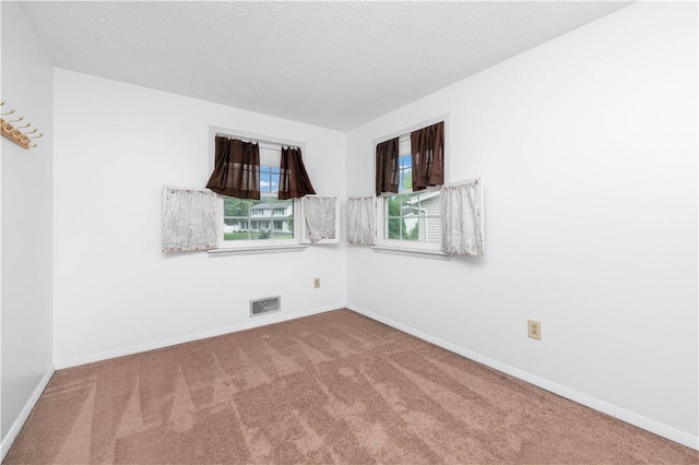 39 Southwind Ct, Greece, NY 14626 - carpeted spare room with baseboards and a textured ceiling