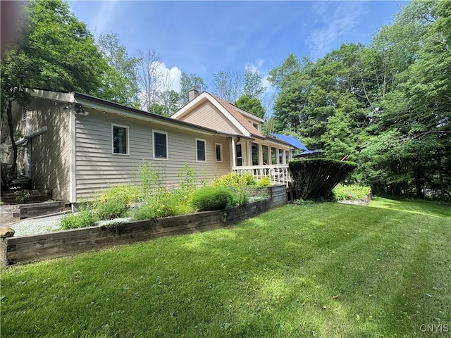 1708 Bonney Rd, Hamilton, NY 13346 - view of property exterior featuring a chimney and a yard