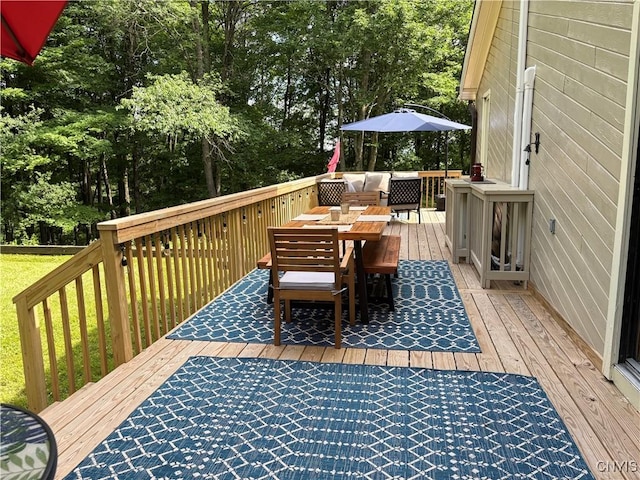 1708 Bonney Rd, Hamilton, NY 13346 - deck with outdoor dining area and view of scattered trees
