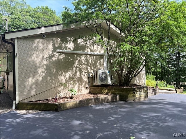 1708 Bonney Rd, Hamilton, NY 13346 - view of side of property with an ac unit and a patio