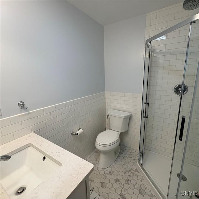 1708 Bonney Rd, Hamilton, NY 13346 - full bathroom featuring tile walls, vanity, a stall shower, wainscoting, and tile patterned floors