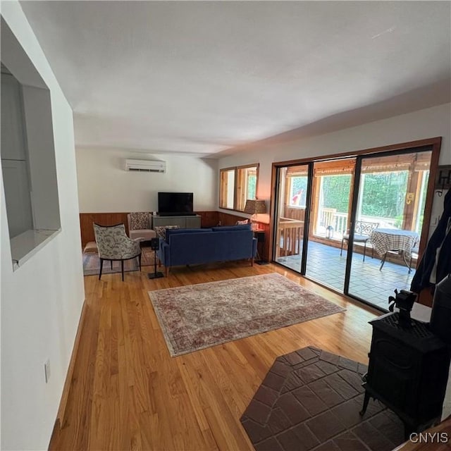 1708 Bonney Rd, Hamilton, NY 13346 - living area with a wall unit AC and wood finished floors