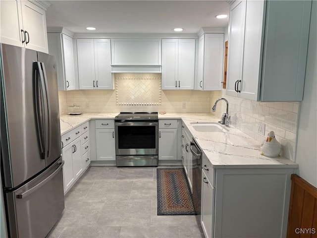 1708 Bonney Rd, Hamilton, NY 13346 - kitchen with stainless steel appliances, backsplash, light stone counters, white cabinetry, and recessed lighting