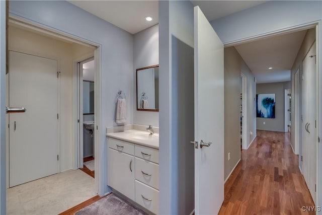 1348 Sunset Rdg, Watertown-Town, NY 13601 - bathroom featuring vanity, wood finished floors, and recessed lighting