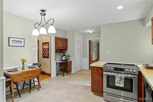 63 Chauncey Ln, Orchard Park, NY 14127 - kitchen featuring appliances with stainless steel finishes, light countertops, an office area, arched walkways, and recessed lighting