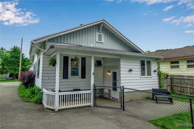 18 Bader Ave, Collins, NY 14070 - view of front facade featuring board and batten siding and a gate
