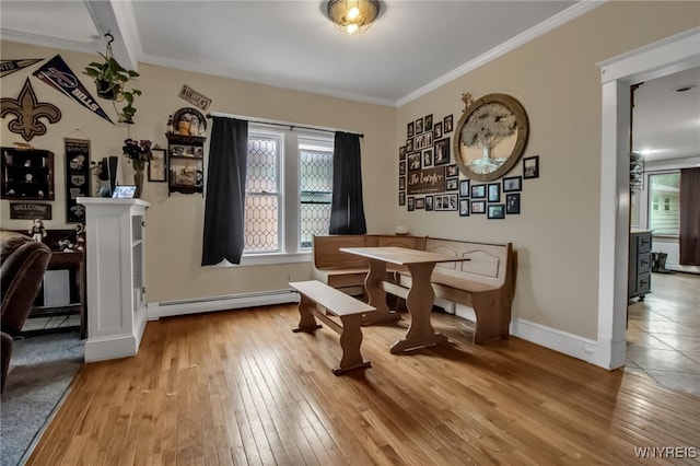 18 Bader Ave, Collins, NY 14070 - dining room with baseboard heating, light wood-style flooring, and ornamental molding