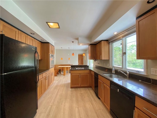 919 Fassett Rd, Elmira, NY 14905 - kitchen with black appliances, a peninsula, light wood-style floors, decorative light fixtures, and recessed lighting