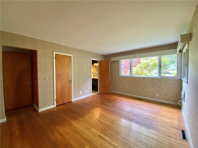919 Fassett Rd, Elmira, NY 14905 - unfurnished bedroom with wood finished floors