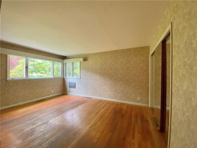 919 Fassett Rd, Elmira, NY 14905 - unfurnished room with wood finished floors and baseboards