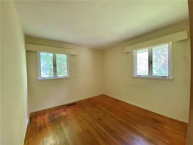 919 Fassett Rd, Elmira, NY 14905 - spare room with hardwood / wood-style flooring and baseboards