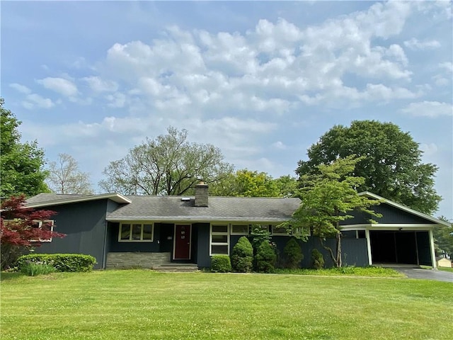 919 Fassett Rd, Elmira, NY 14905 - view of front of home featuring a front lawn, driveway, a chimney, a garage, and stone siding