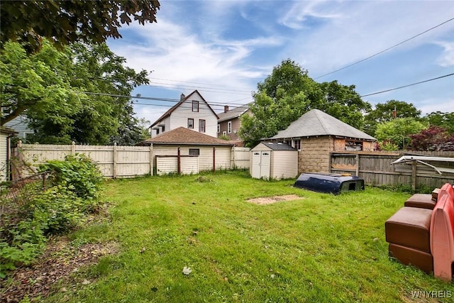 132 Ryan St, Buffalo, NY 14210 - fenced backyard with a storage unit