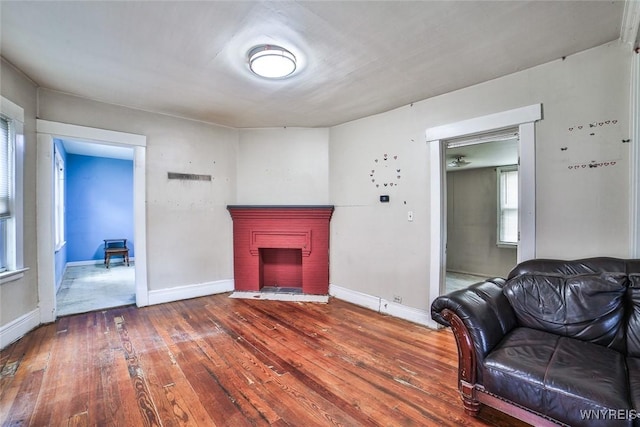 132 Ryan St, Buffalo, NY 14210 - living area with hardwood / wood-style flooring and a brick fireplace