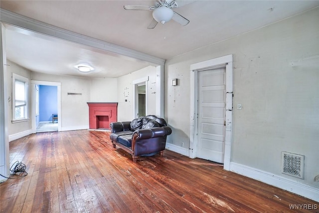 132 Ryan St, Buffalo, NY 14210 - living room featuring hardwood / wood-style flooring, a ceiling fan, and a brick fireplace