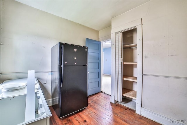 132 Ryan St, Buffalo, NY 14210 - kitchen featuring freestanding refrigerator and wood-type flooring