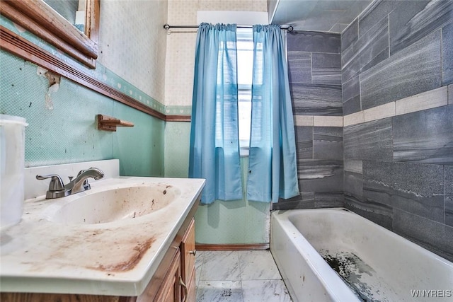 132 Ryan St, Buffalo, NY 14210 - bathroom with vanity, marble look tiles, and shower / tub combination