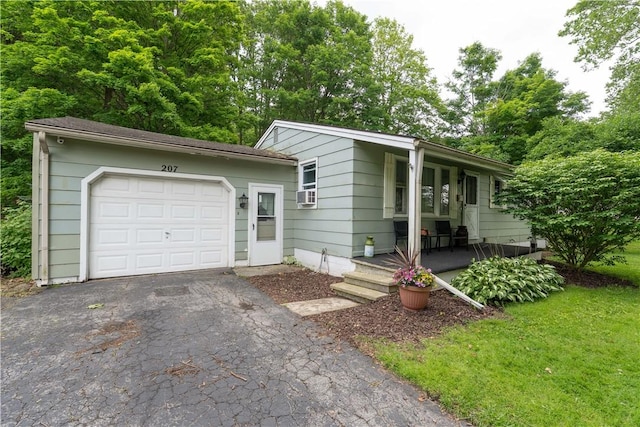 207 County Road 7, Manchester, NY 14432 - single story home with a porch, asphalt driveway, and cooling unit