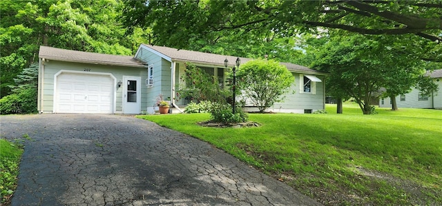 207 County Road 7, Manchester, NY 14432 - view of front of property featuring an attached garage, asphalt driveway, and a front lawn